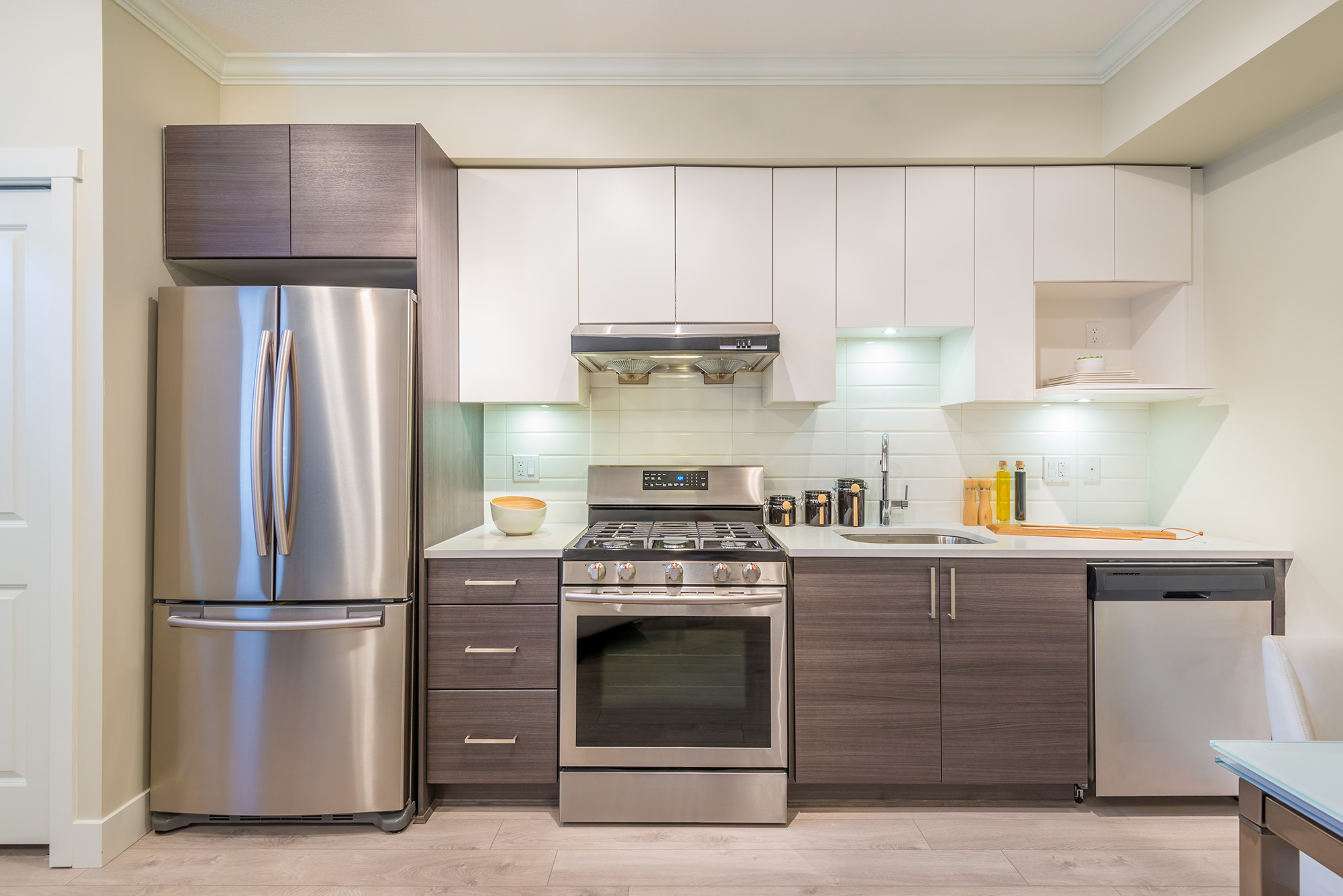 Modern, bright, clean, kitchen interior with stainless steel app